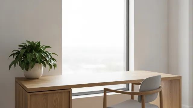 A quiet, sunlit modern office space.